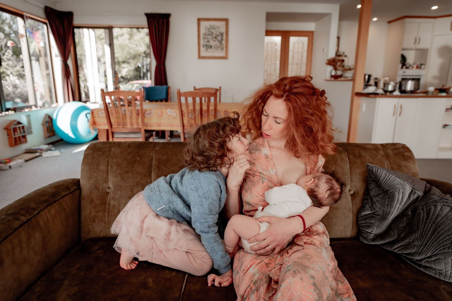Mother holding newborn baby in nursery
