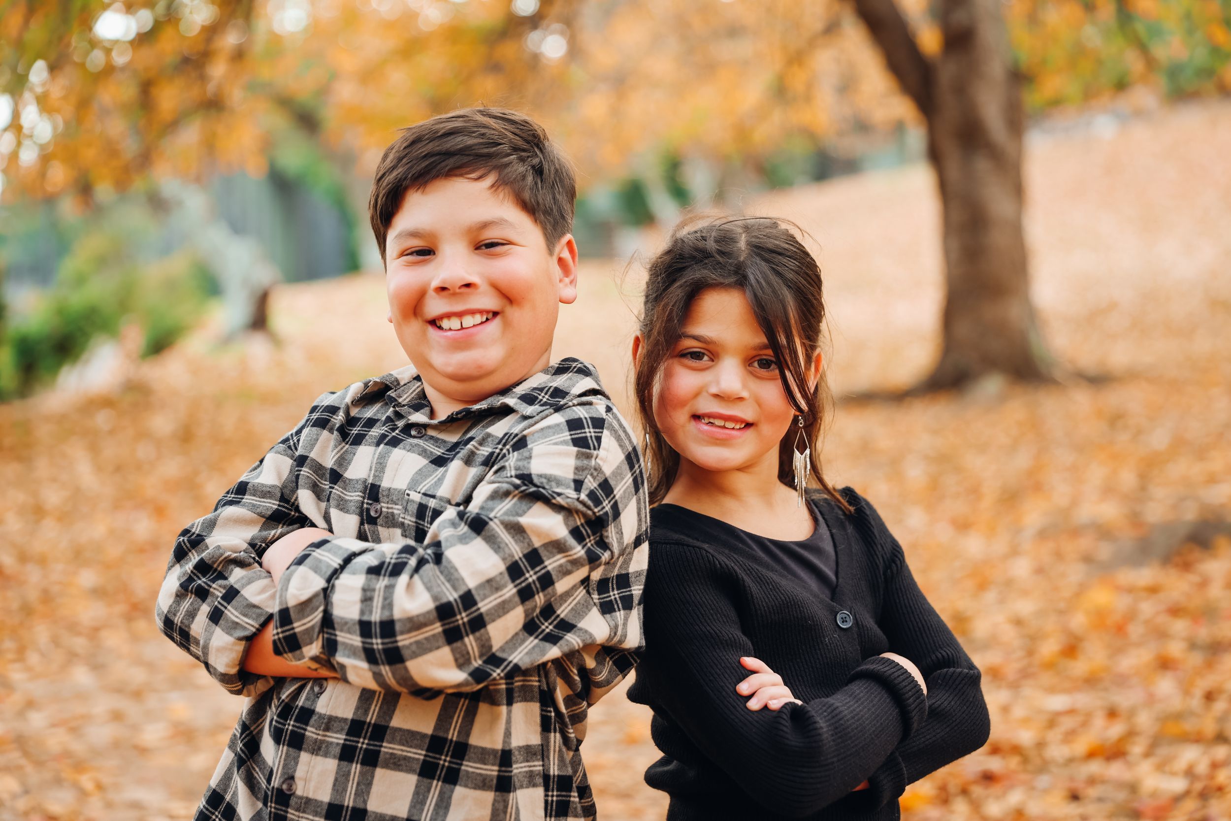 Family members share joyful moments together during fall photo shoot.