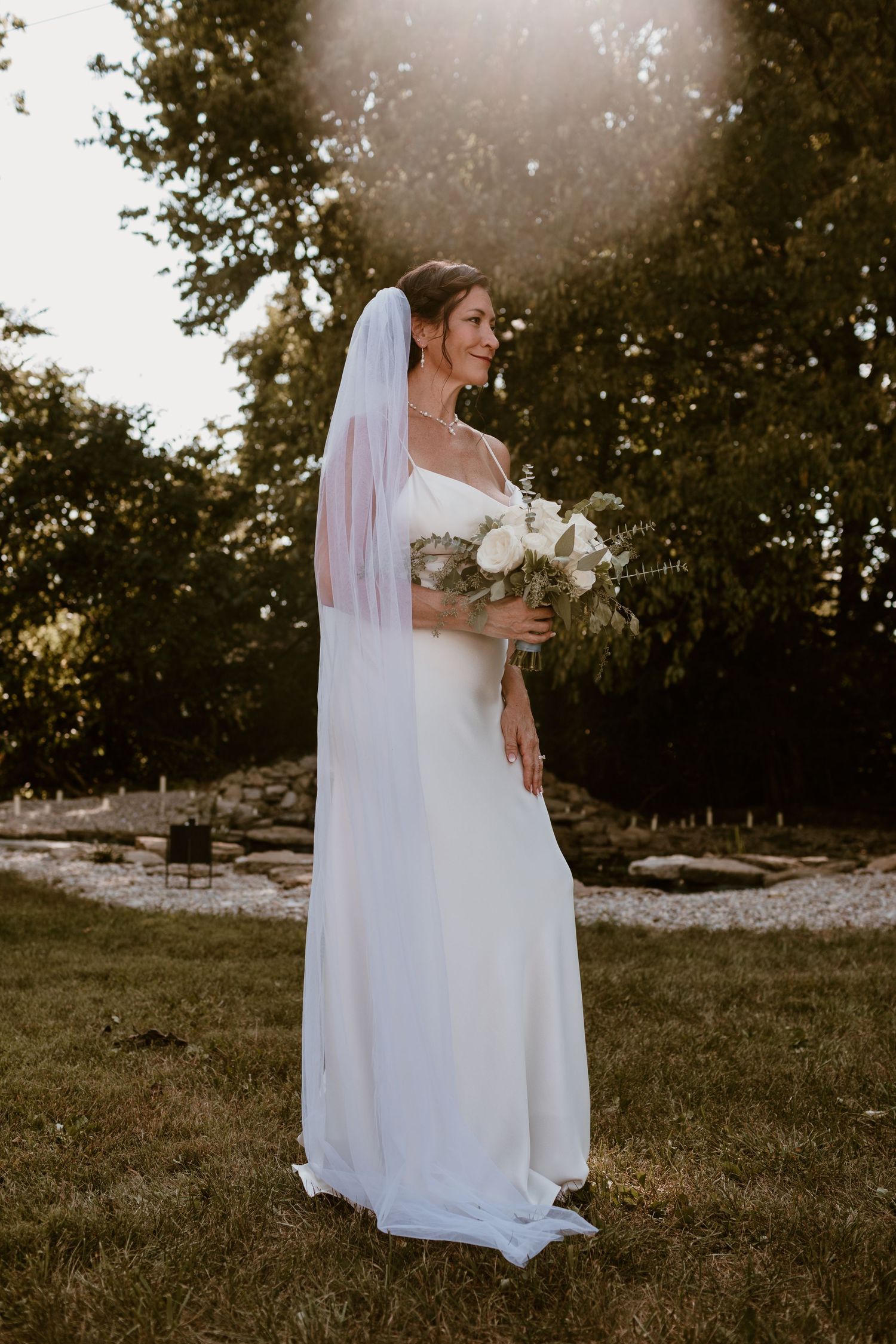 Bridal portrait, standing holding bouquet for summer backyard wedding in Ohio photography by Vicci Photo Dayton Ohio Photographer
