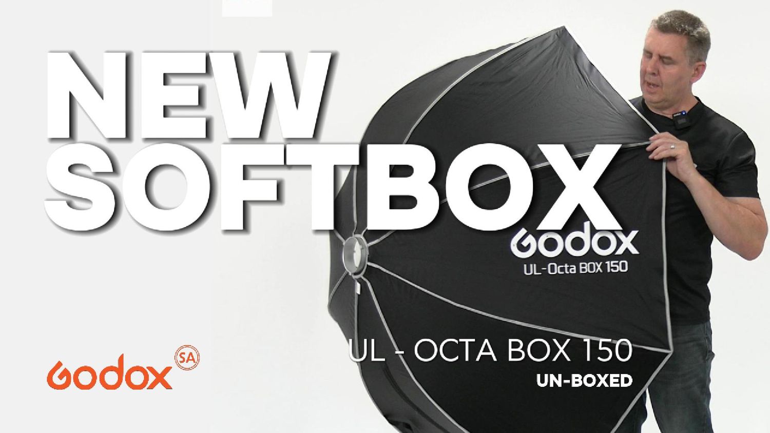 Godox UL-Octa Box 150 softbox unboxing video thumbnail featuring a man holding the large octagonal light modifier.