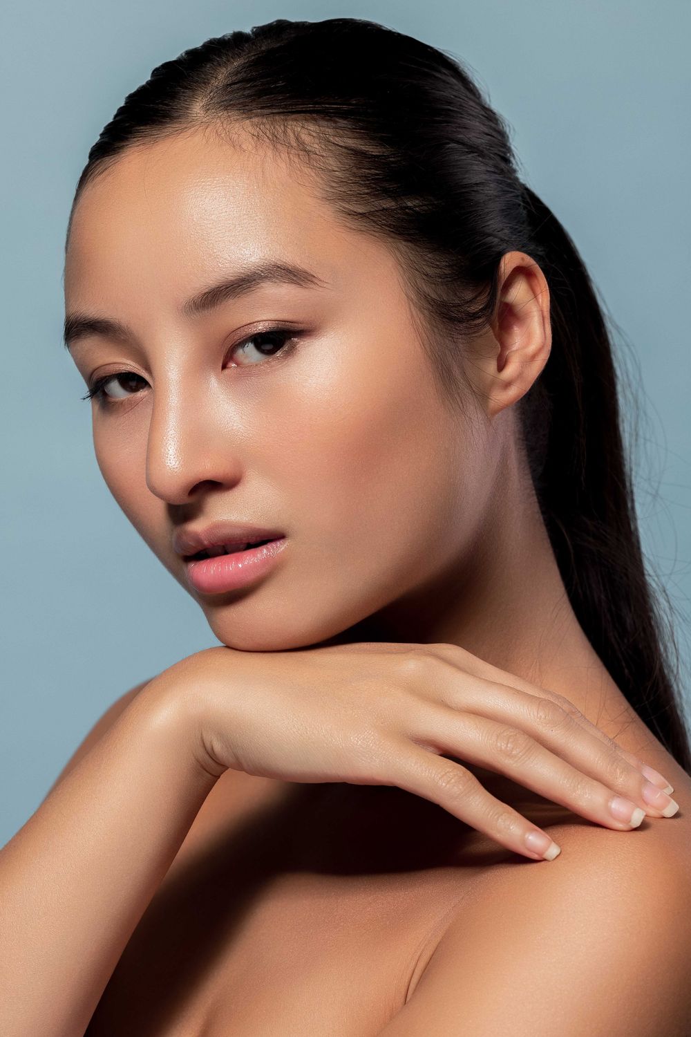 Elegant beauty portrait series with glowing skin and subtle makeup.