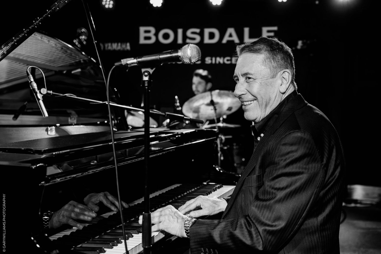 Black and white photo of Jools Holland on stage at Boisdale