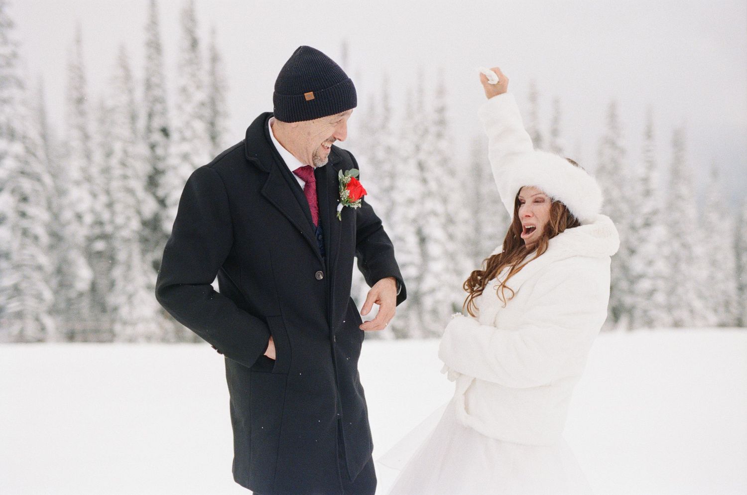bride fist pumps after elopement ceremony on a mountain in Revelstoke, BC