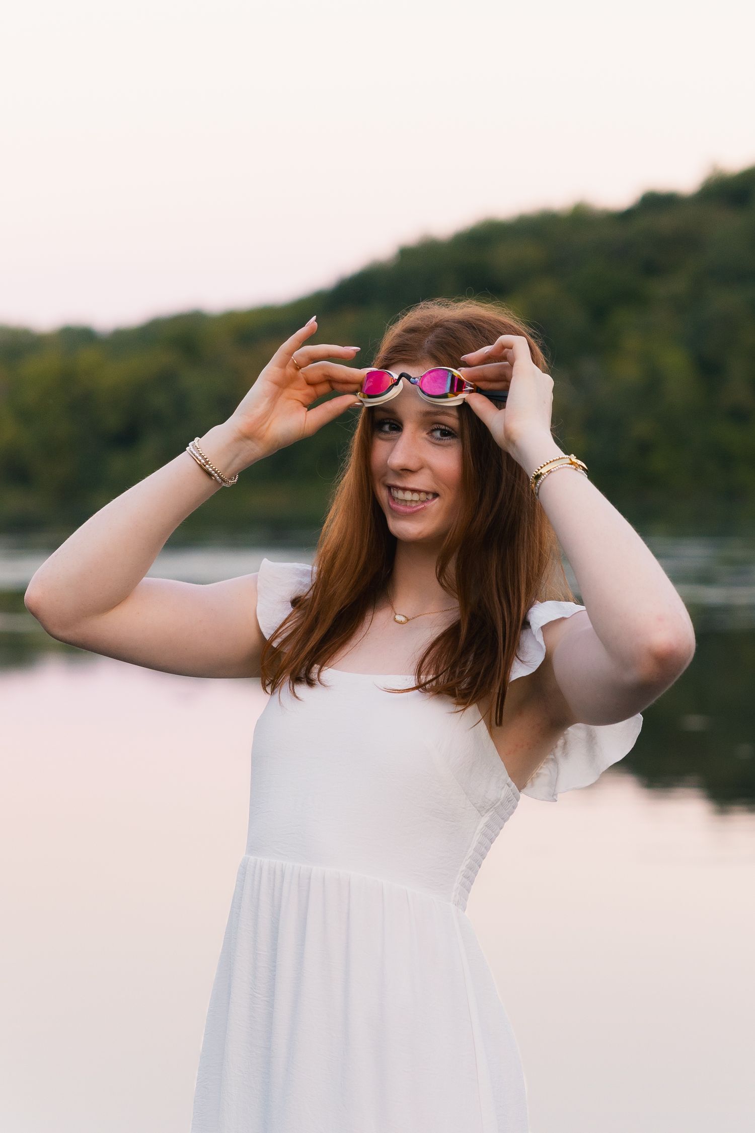 high school senior photos swimming goggles swimmer athlete girl white dress water madison wi props sports indian lake talent hobby interests