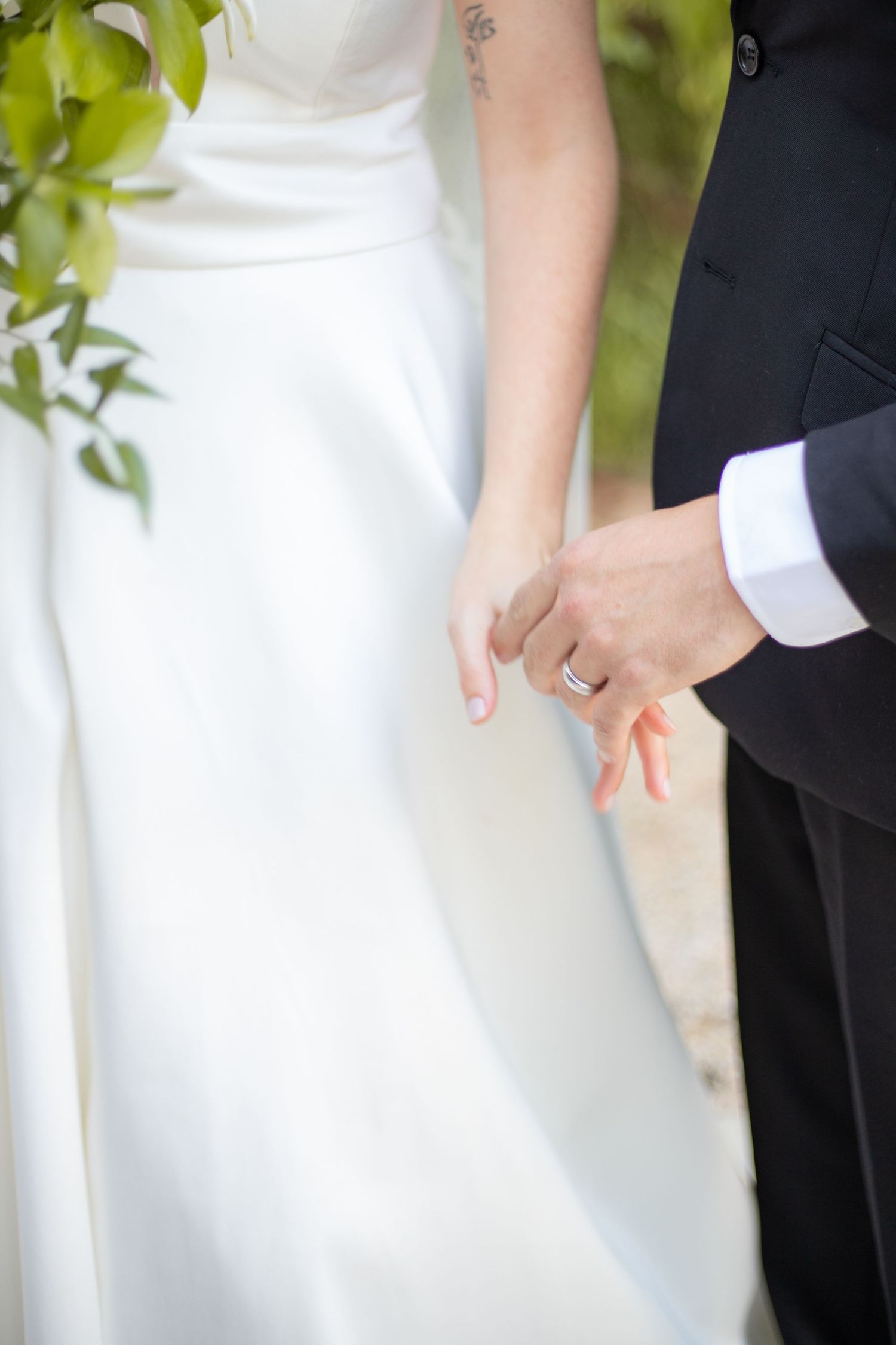 Bride and groom holding hands