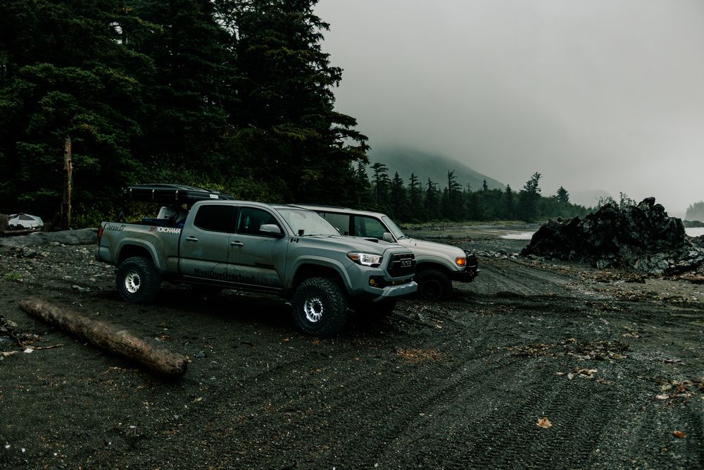 A series of connected landscape photos showing parking lots and misty forest scenery in mountainous terrain.