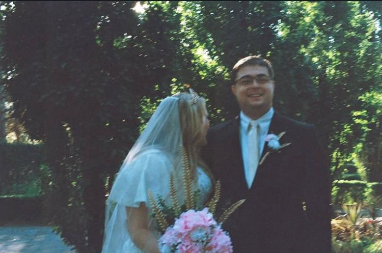 Bride and groom laughing in a candid film photos at an Utah garden wedding venue.