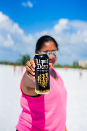 liquid death, siesta key beach shoot, sphere collab, sphere soccer, soccer and fitness