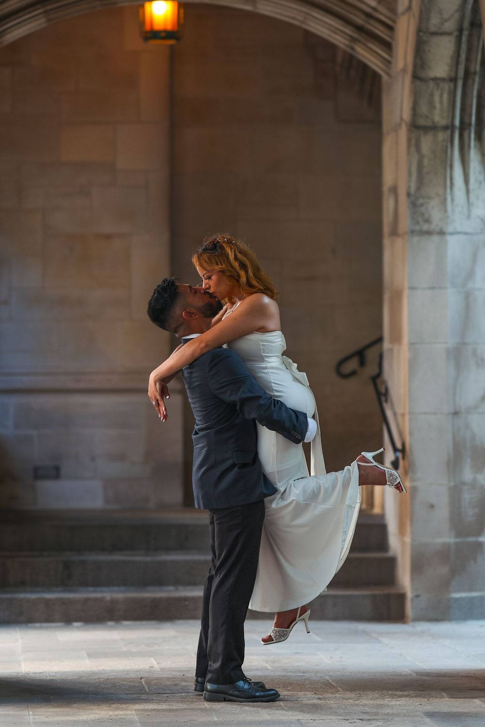 Couple performs dramatic dip pose during wedding photography session.