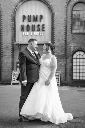 Monochrome series of wedding portraits showing couple dancing in front of historic Pump House building.