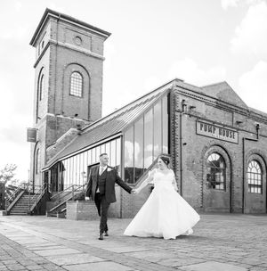 A series of black and white wedding photos taken at a historical brick building with large archways and clock towers.