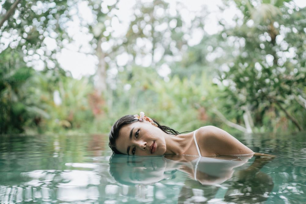 Serene moments captured in a crystal clear infinity pool with jungle views.