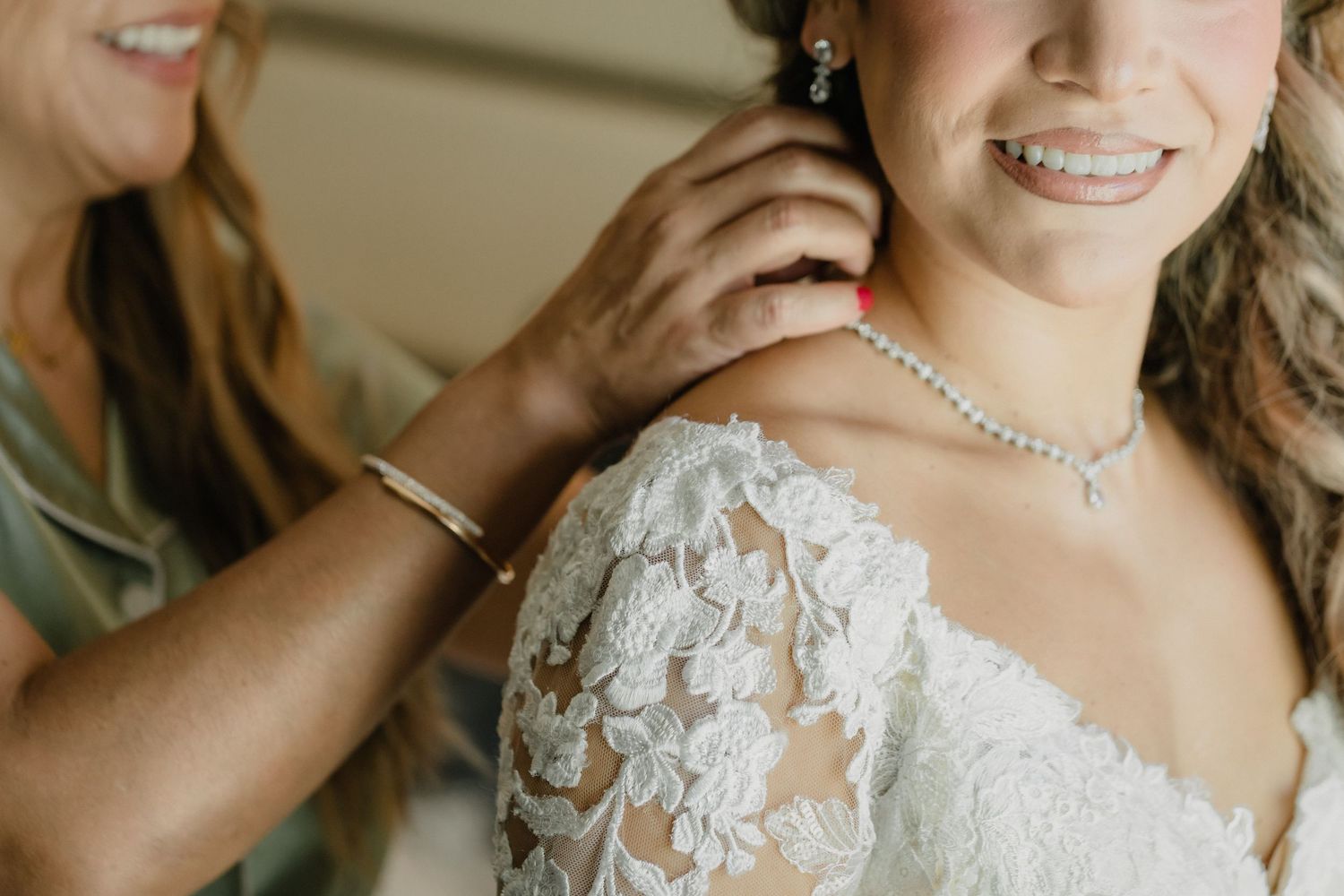 Bridal preparation scene showing delicate lace details of a wedding dress and pearl jewelry for Sacramento wedding.