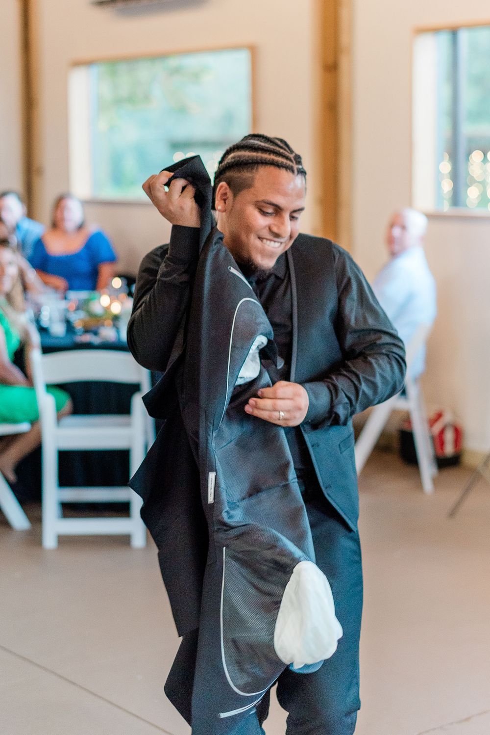 A joyful dancing sequence in formal attire shows energetic movement across a bright indoor venue.