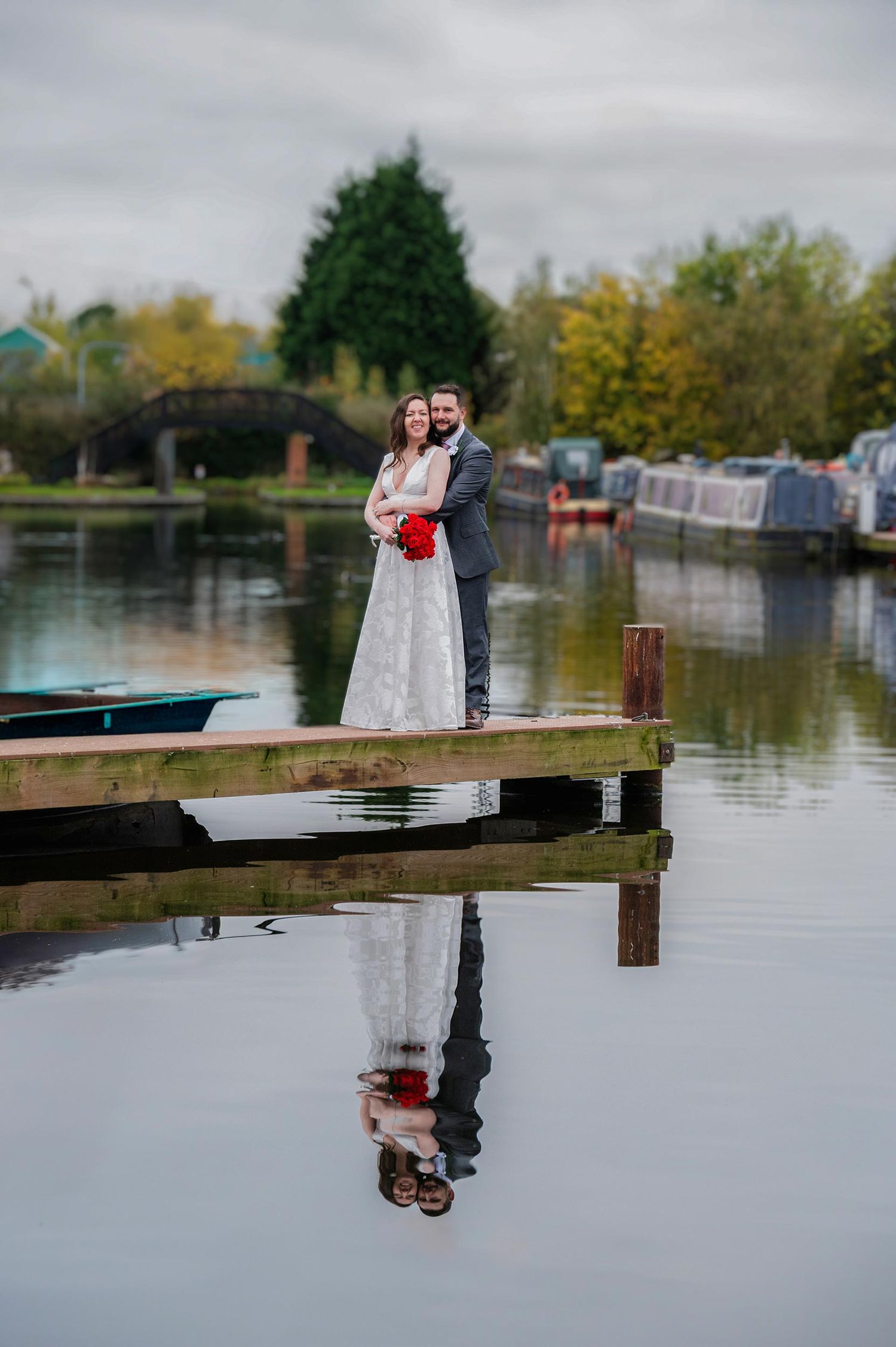 Crows Nest Barton wedding photographer captures a bride and Groom overlooking the marina.