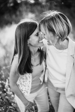 Black and white photo series showing tender intimate moments between a couple in nature.