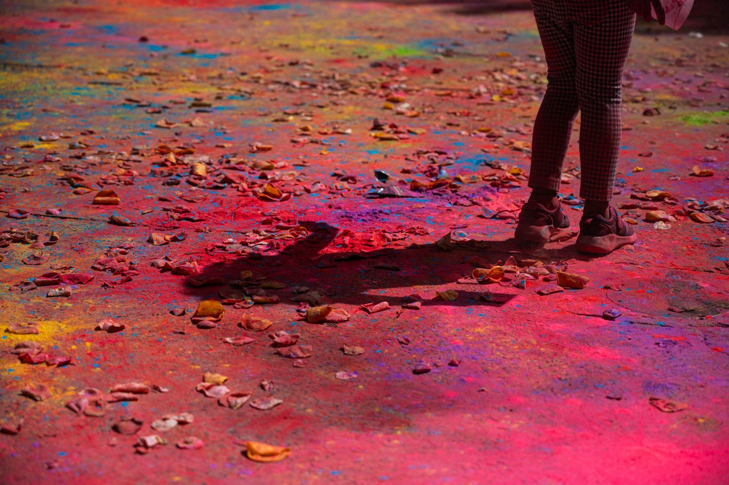 Young girl walking over paint at Holi Hai Festival in south Eveleigh, Sydney.