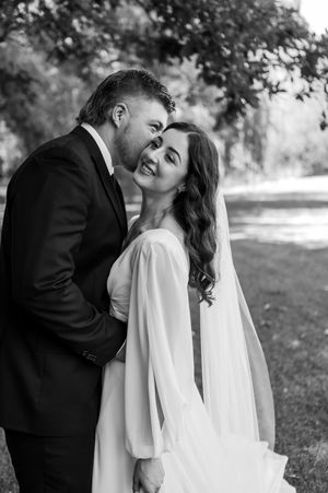 Romantic black and white wedding portrait showing couple in intimate moment outdoors. christchurch wedding photography