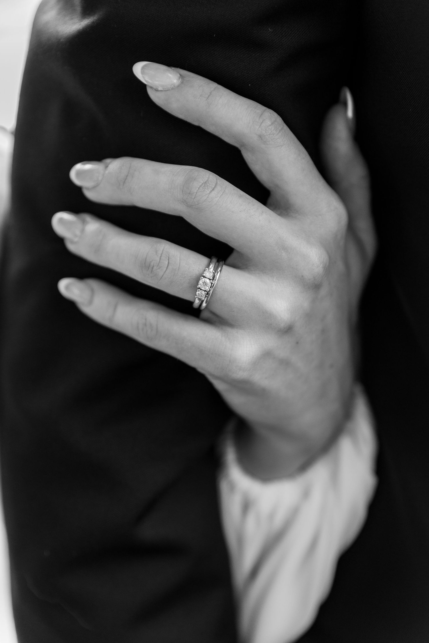 A close-up series showing wedding rings and hands in black and white photography. christchurch wedding photography