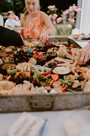 Wedding reception grazing table filled with artisanal cheeses, fruits, crackers and appetizers. christchurch wedding photography