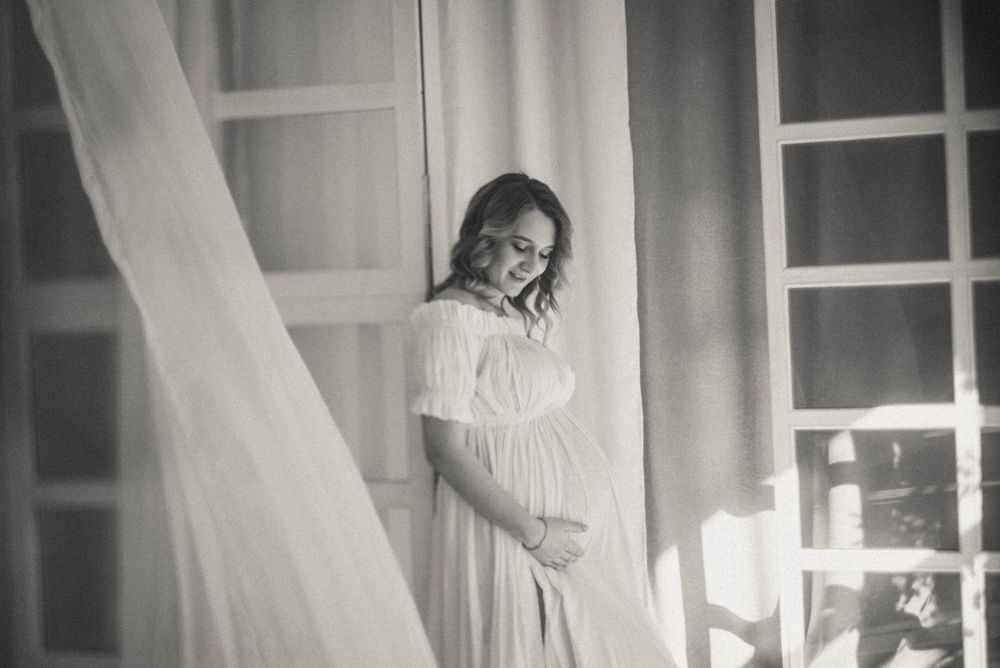 Intimate couple photography session with soft natural window light.
