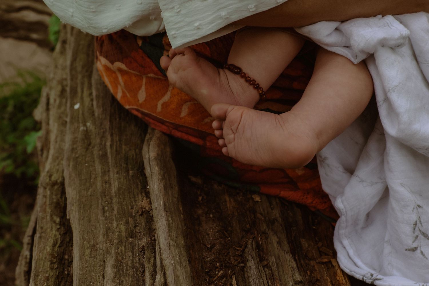 detail of baby feet in outdoors location, natural and earth, natural light, colour