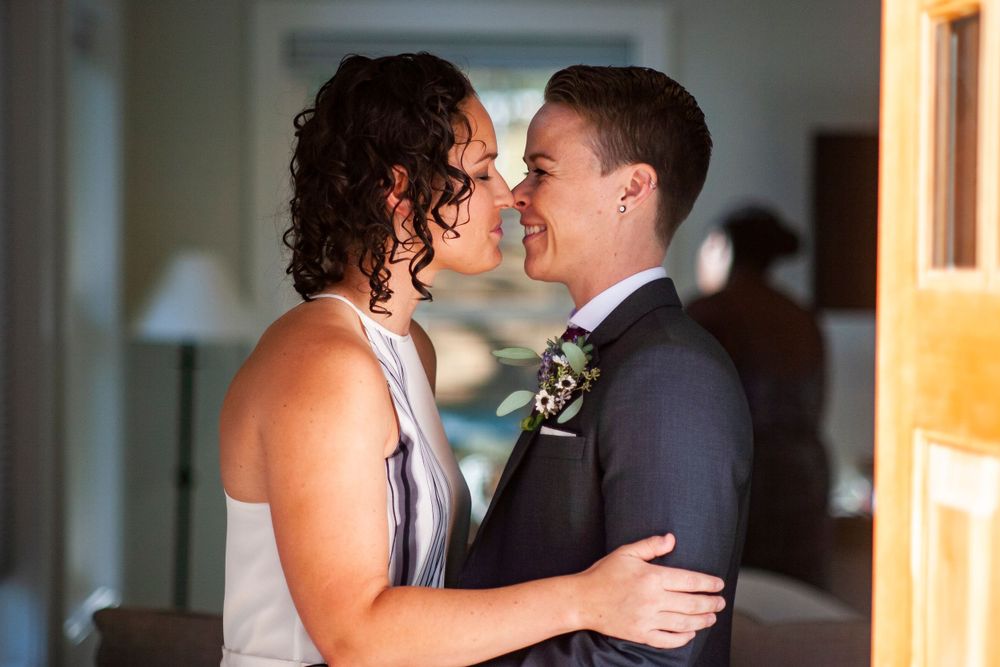 A wedding couple shares a kiss during their First Look