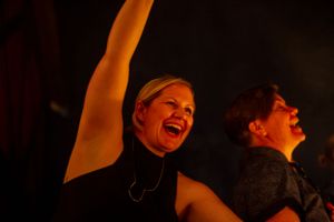 Wedding guests cheer for the couple