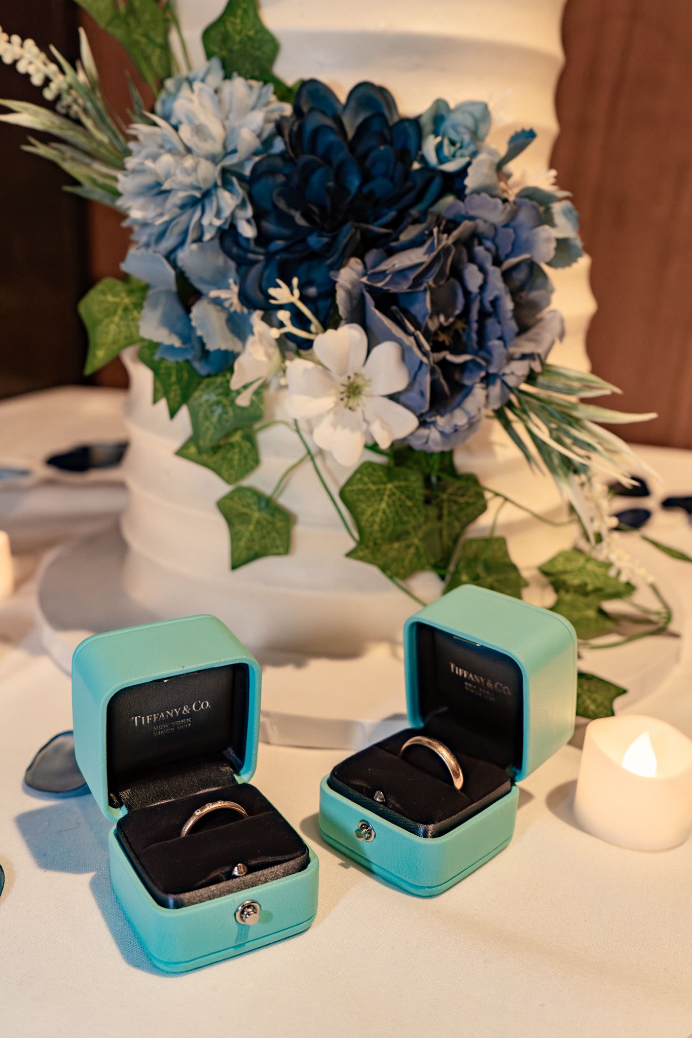 Tiffany blue jewelry boxes with blue floral arrangements displayed in a sequence showing different angles and perspectives.