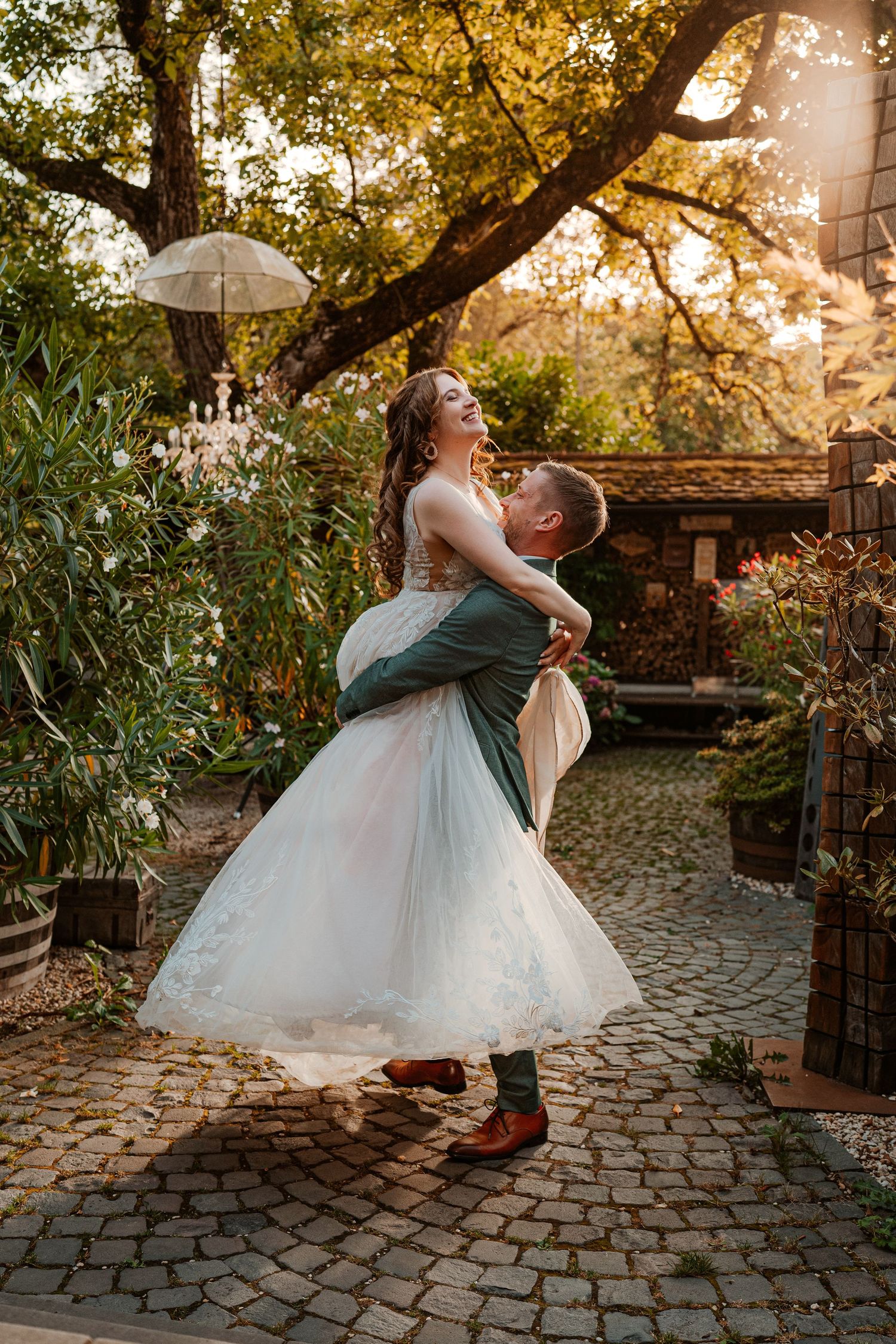 Intimate romantic couple sharing tender kisses in moody lighting with warm orange glow.