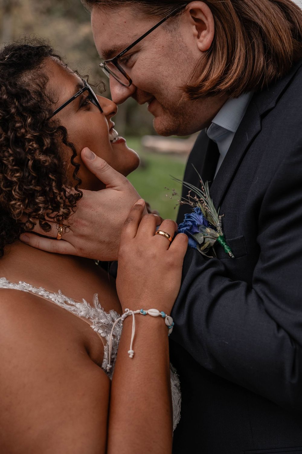 Romantic wedding couple shares intimate kisses in a series of candid outdoor portrait photographs.