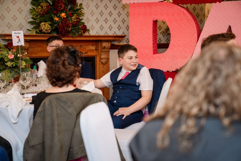 A series of wedding reception photos showing guests dancing and celebrating at a festive indoor venue.