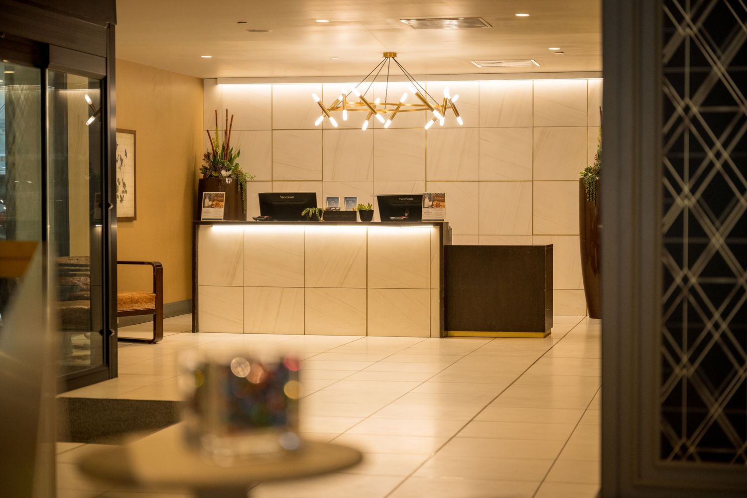 Lifestyle photo of front desk at the Magnolia Hotel by Denver Hospitality, Travel & Tourism photographer Captain Colorado Photography.