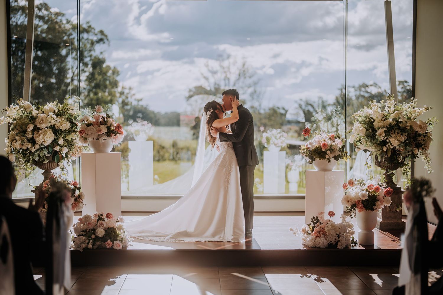 A collage of wedding photographs showing floral arrangements and bridal moments in a light-filled venue.