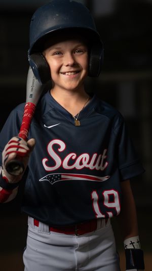 Youth baseball player in navy blue Scouts uniform holds red bat while smiling in series of action poses.