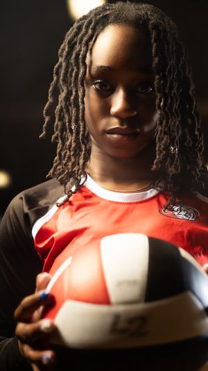 A series of progressive shots showing someone with dreadlocks and a red jersey smiling against a dark background.