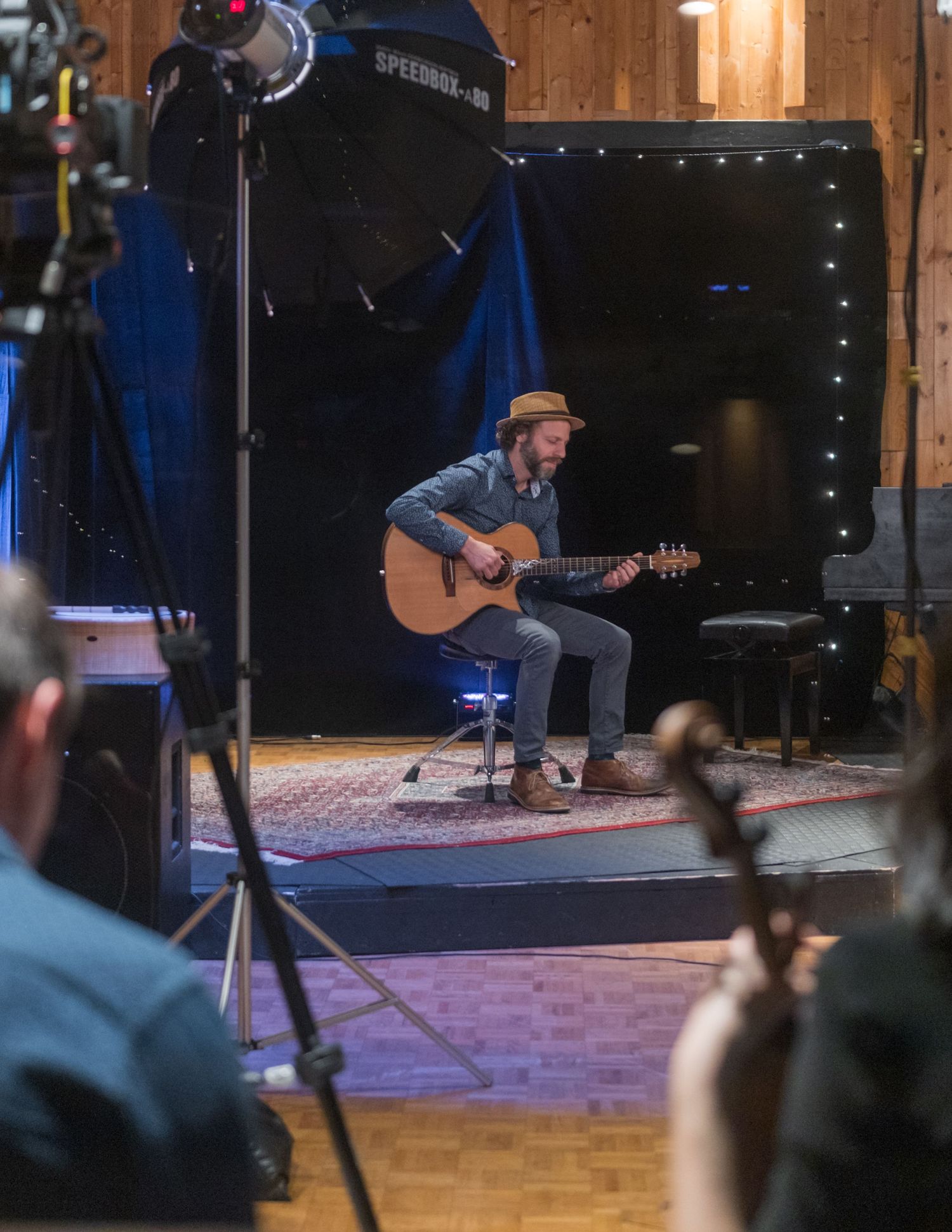 Brand photography session for musicians, woman playing violin and man playing guitar, Vancouver music studio