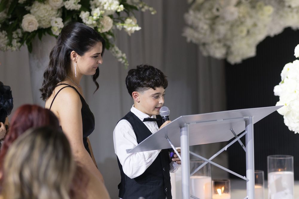 White floral arrangements and decor at an elegant wedding reception venue.