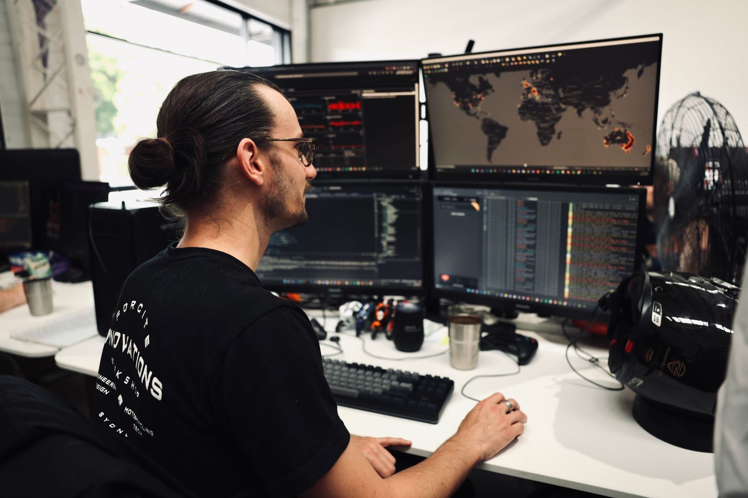 Professional video production setup with multiple monitors and editing equipment.