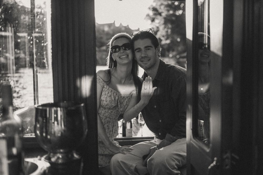 Black and white photo series inside boat cabin with natural light streaming through windows.