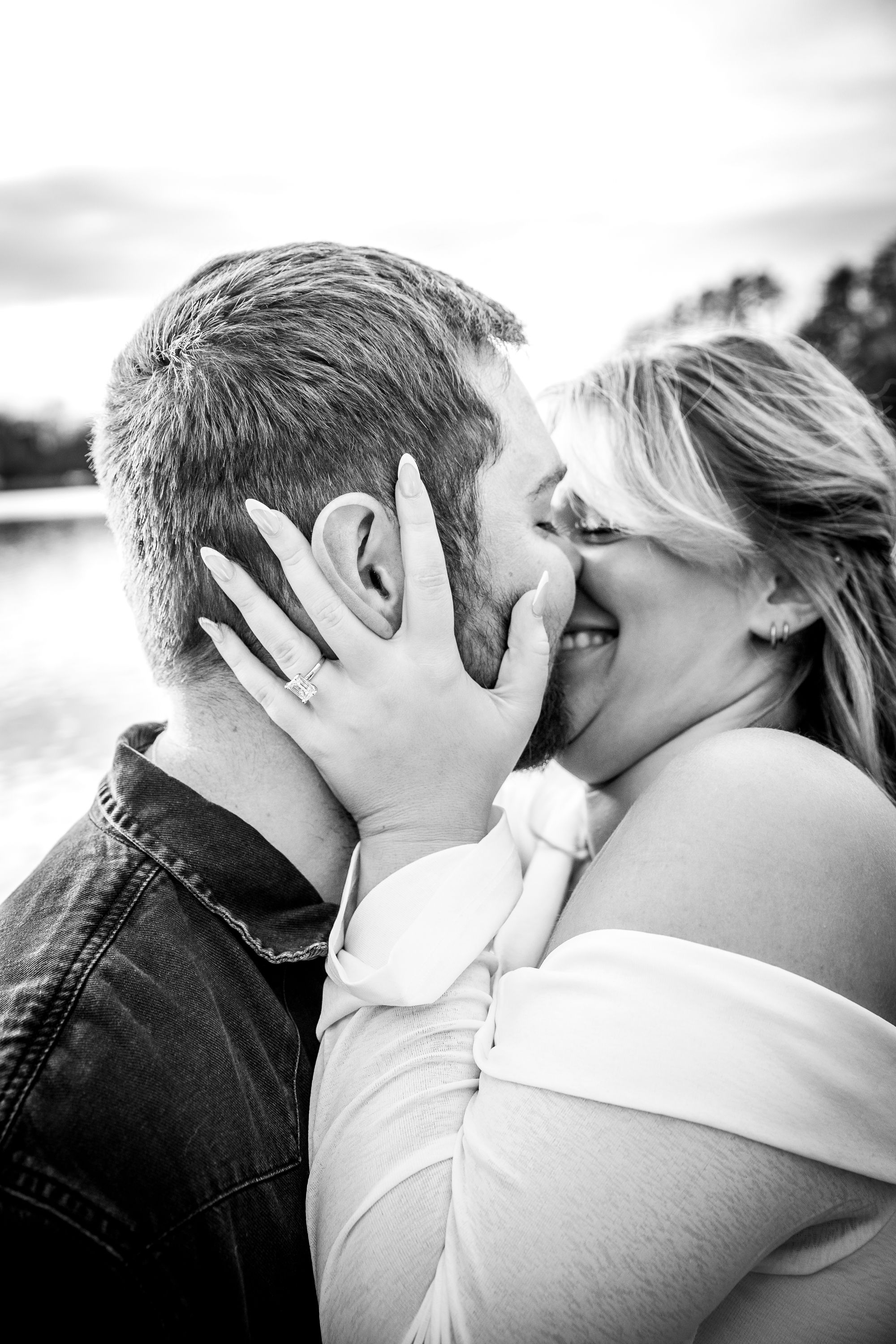 A romantic black and white photo sequence showing a couple sharing a passionate kiss.