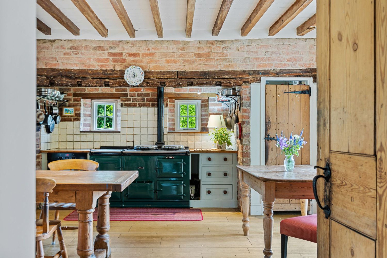 Property photography capturing a lifestyle image of a countryside kitchen featuring an Aga for a real estate property listing.