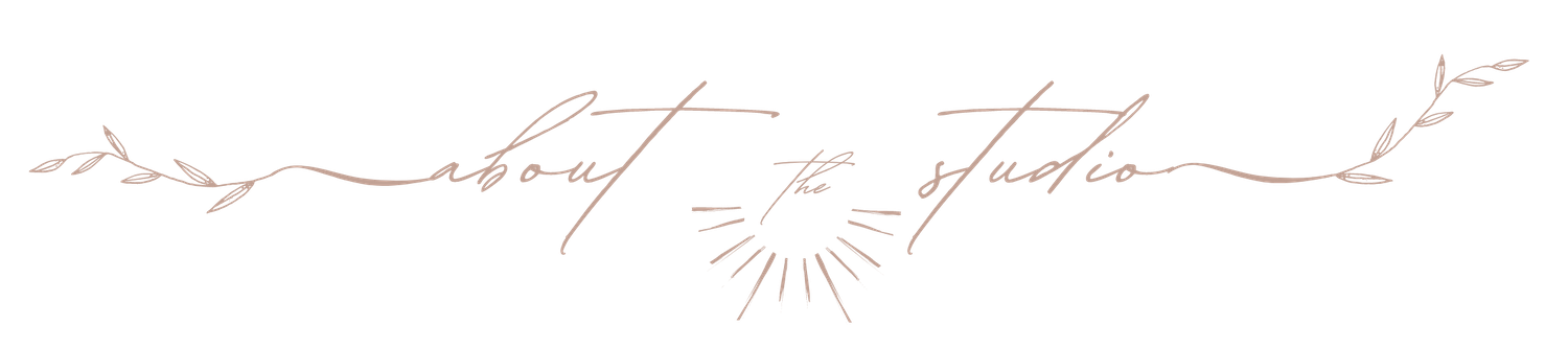 Simple line art showing rolling hills and a small sun design.