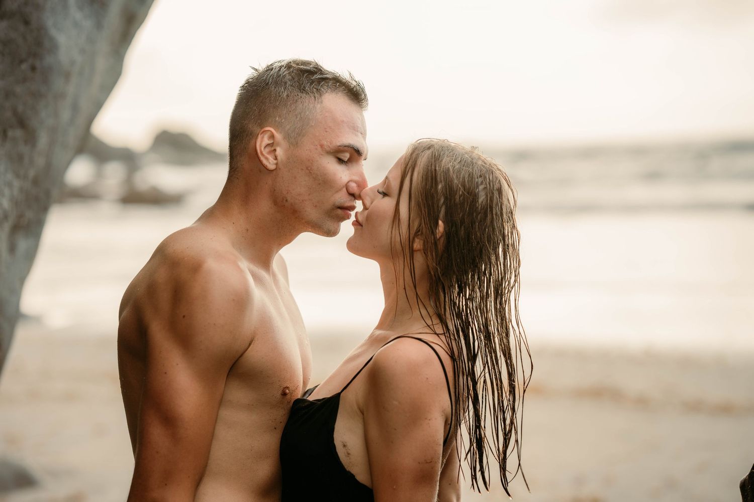 A romantic couples photoshoot at Playa del Roque de las Bodegas, Tenerife, Canary Islands. Capturing love amidst the rugged coastal beauty.