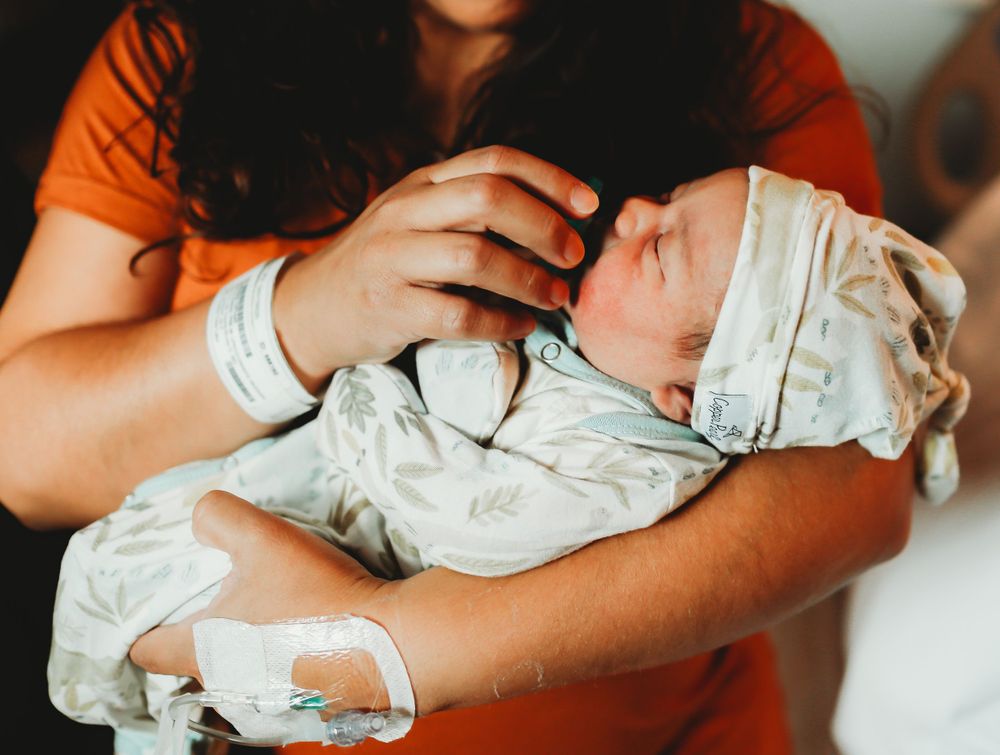New mom giving baby a Paci for fresh 48 session