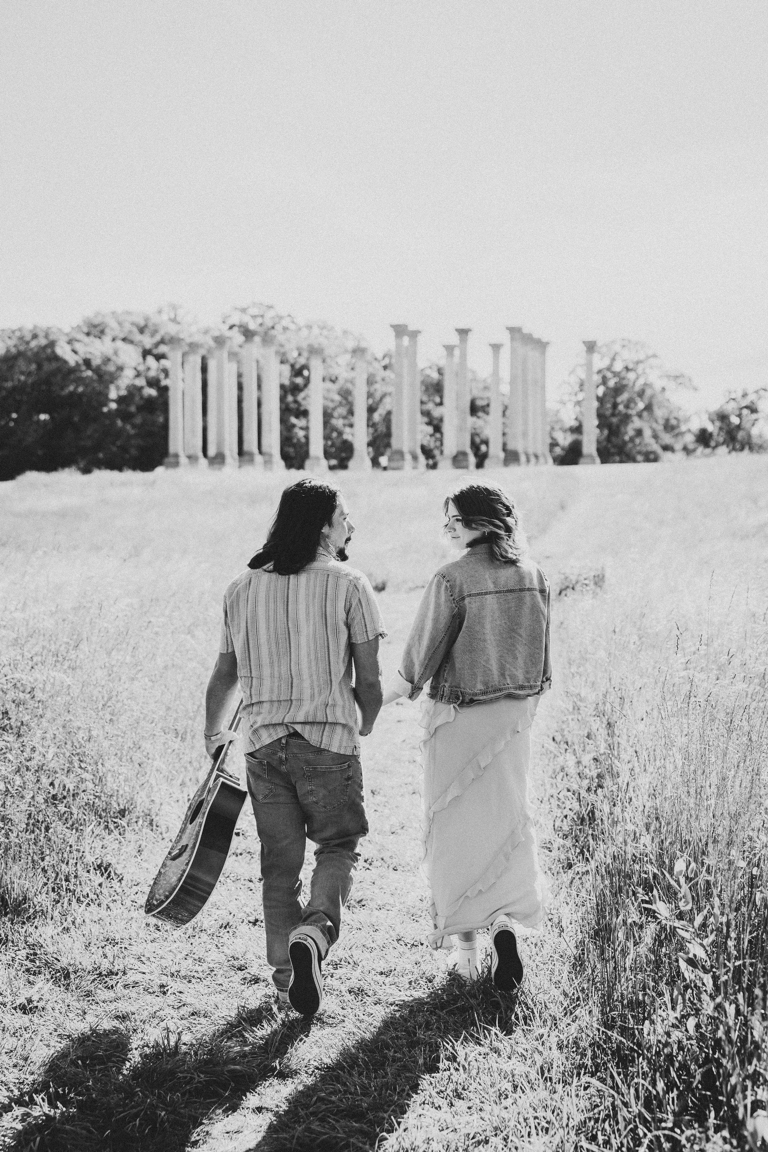 Three vintage black and white photos show two children walking together through a sunny meadow field.