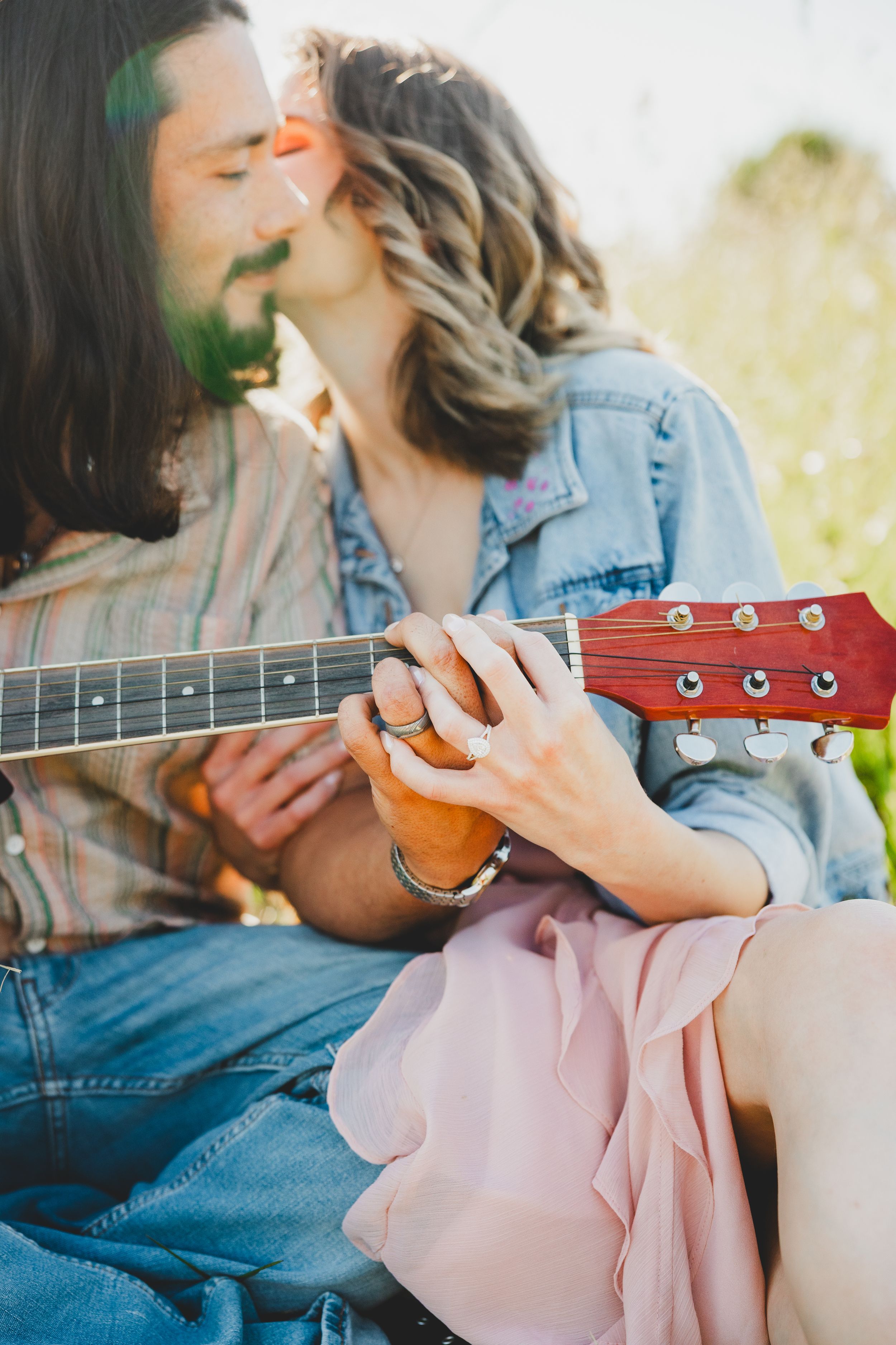 A person in denim and pink plays a ukulele outdoors in a romantic series of cropped photos.