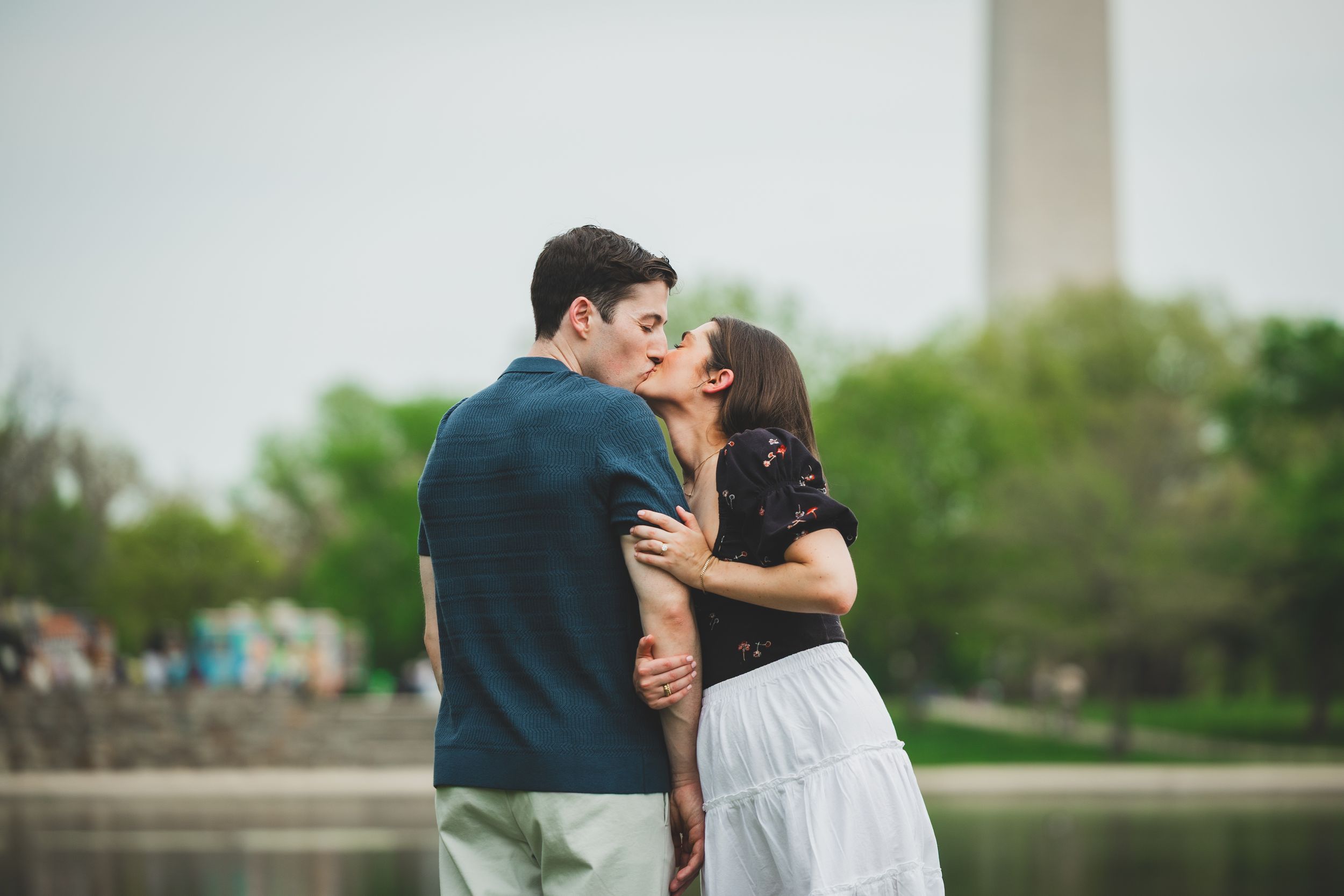 A couple shares romantic moments in an outdoor photoshoot across multiple connected frames.