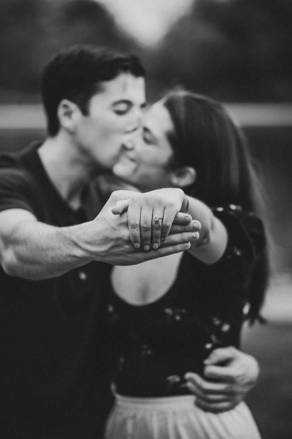 Black and white romantic dance sequence showing couple in intimate embrace and dip pose.