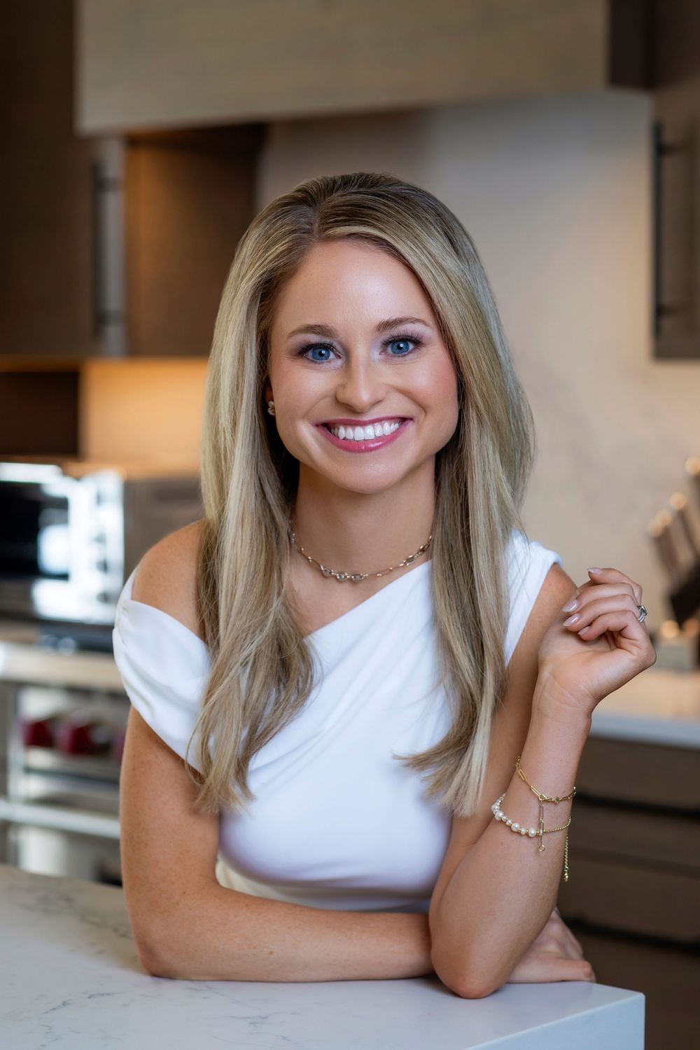 Casual headshots of a woman in white against a blurred kitchen background.